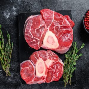 Raw dry-aged grass-fed beef shank (osso buco) from Longbottom Farm displayed on cutting board