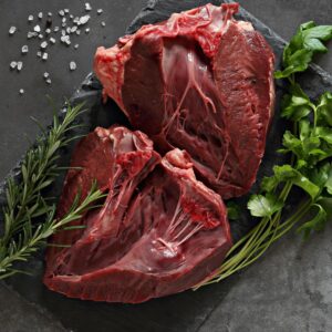 Raw grass-fed beef heart from Longbottom Farm displayed on cutting board
